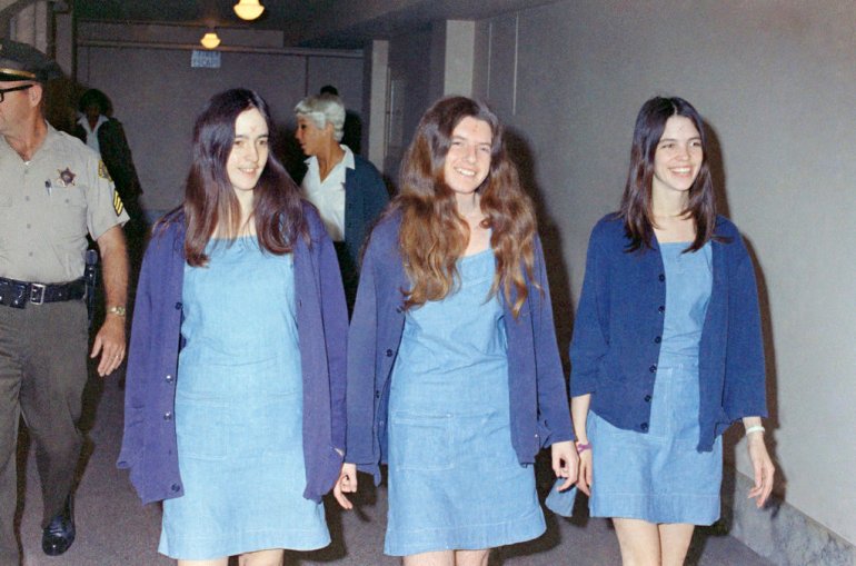 In this 1970 photo, Charles Manson followers, from left: Susan Atkins, Patricia Krenwinkel and Leslie Van Houten, walk to court to appear for their roles in the 1969 cult killings of seven people, including pregnant actress Sharon Tate, in Los Angeles, California [George Brich, File/AP]
