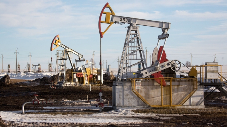 Oil pumping jacks, also known as "nodding donkeys", operate in an oilfield near Almetyevsk, Tatarstan, Russia, on Wednesday, March 11, 2020. Saudi Aramco plans to boost its oil-output capacity for the