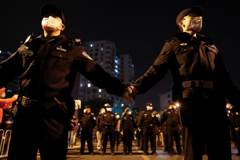 A heavy police presence at a protest against COVID-19 restrictions in Beijing, China.