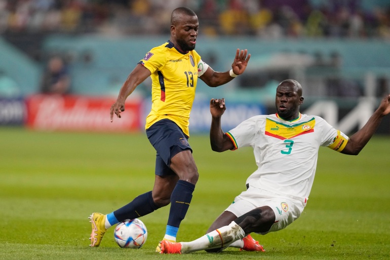 Ecuador's Enner Valencia, left, and Senegal's Kalidou Koulibaly challenge for the ball