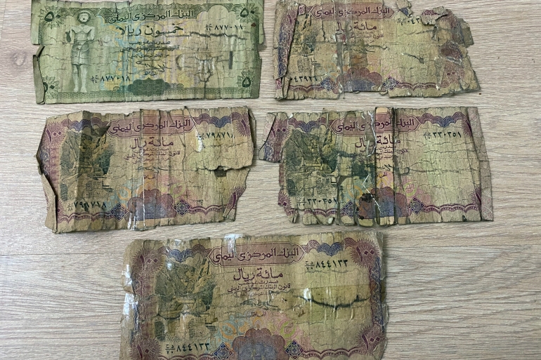Tattered Yemeni bank notes