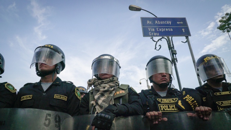 A line of riot police in Lima, Peru, standoff against anti-government protesters in January
